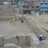 Cleaning at Huaca Monterrey in Ate, Lima that once more is surrounded by residences